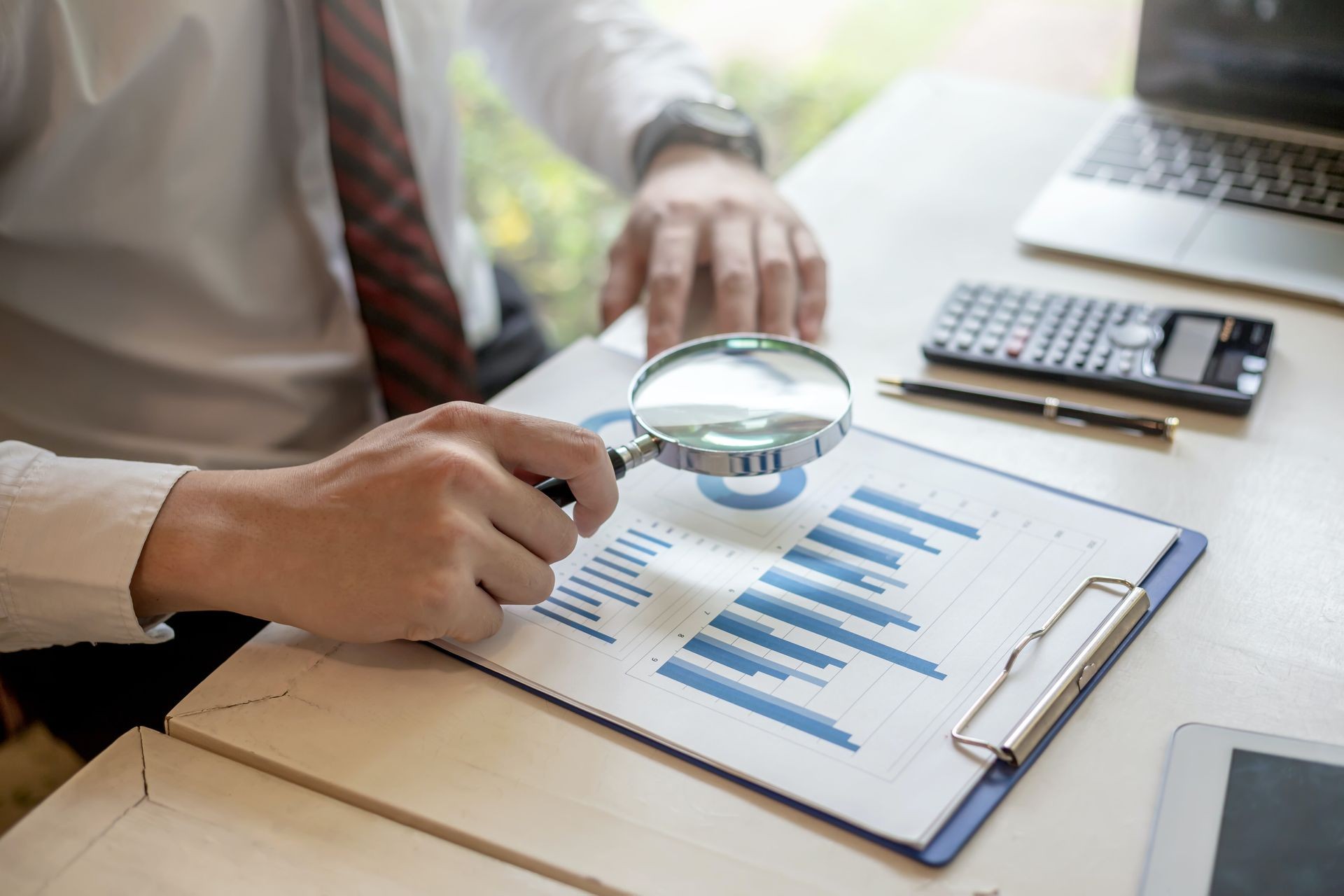 man with magnifying glass